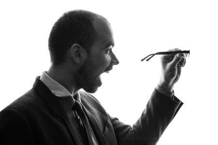 Caucasian businessman silhouette on the white background