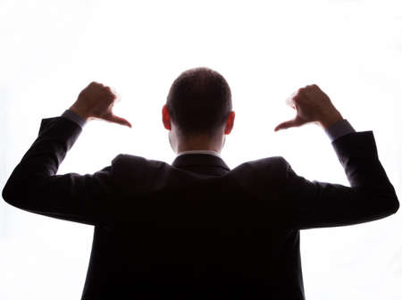 Caucasian businessman silhouette on the white backgroundの写真素材