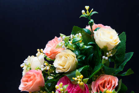 Beautiful bouquet of bright flowers on the black backdropの写真素材