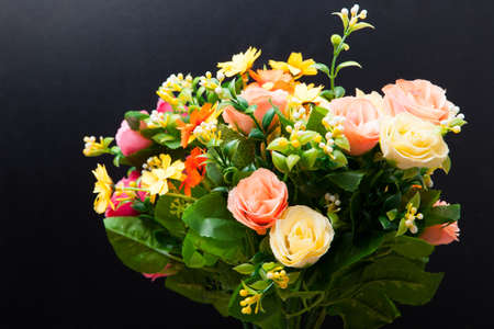 Beautiful bouquet of bright flowers on the black backdropの写真素材