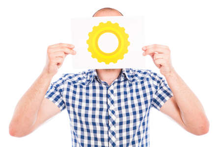 Happy young man with gear sign against the white