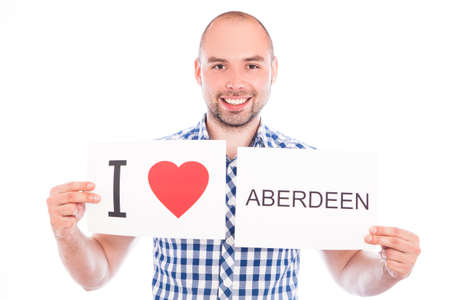 Man with  sign I love Aberdeen. Series of man with English city signsの写真素材