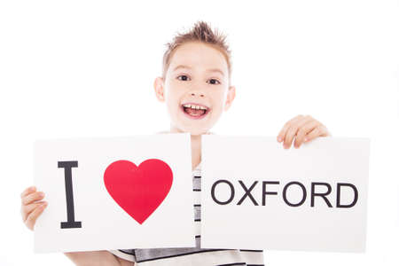 Boy with  sign I love Oxford. Series of boy with English city signs