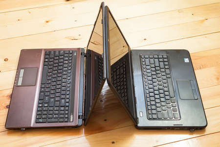 Open laptops  wooden desk.の写真素材