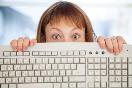 Woman holding keyboard