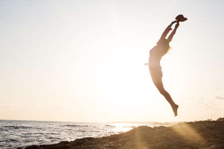 Woman posing at the sunsetの写真素材
