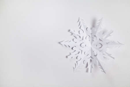 Fine paper snowflake cut out, Christmas background