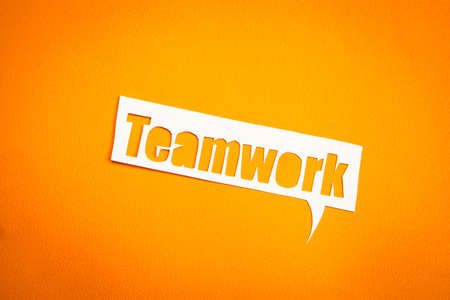 The word Teamwork in speech bubble against orange background