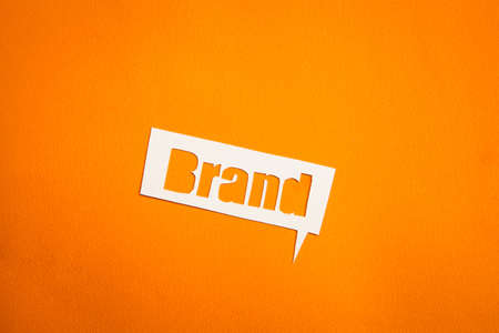 The word Brand in speech bubble against orange backgroundの写真素材