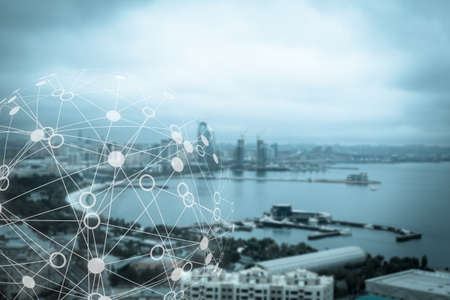 Abstract molecular structure against beautiful city and seafront backgroundの写真素材