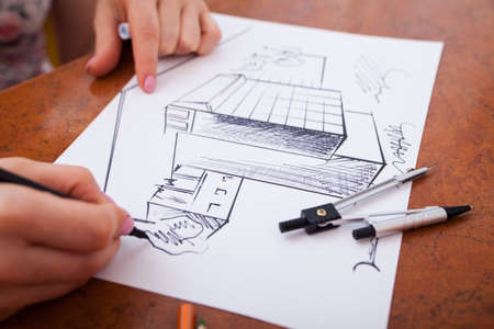 Closeup of drawing building at the deskの写真素材