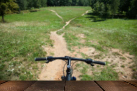 Bike on the forest path with wooden boardの写真素材
