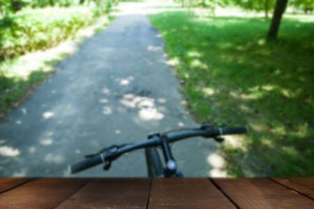Bike on the forest path with wooden boardの写真素材