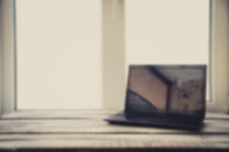 Laptop on the wood table , blurの写真素材