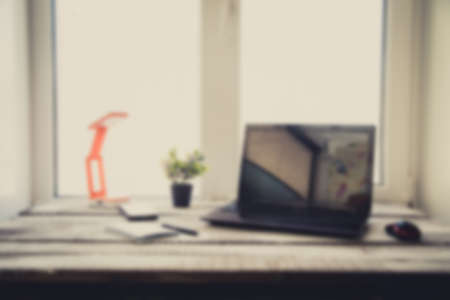 Laptop on the wood table , blurの写真素材