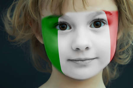 Child with a painted flag of Italyの写真素材