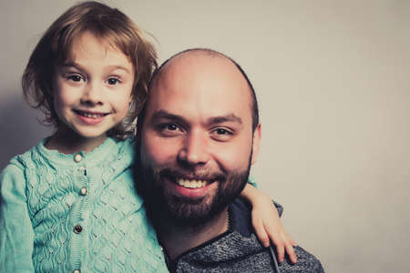 Cute young daughter with her dad.の写真素材