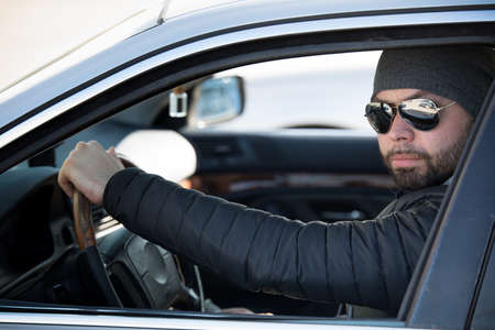 Portrait of man in his car.の写真素材