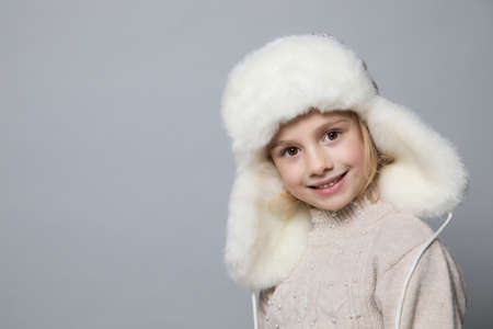 Smiling girl in the winter look, christmas concept.の写真素材
