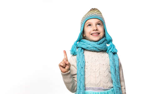 Smiling girl in the winter look wearing funny warm hatの写真素材
