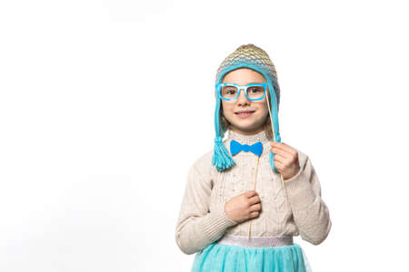 Smiling girl in the winter look wearing funny warm hat