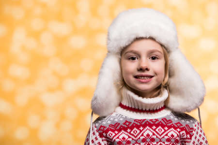Little girl in winter clothing. Christmas concept.の写真素材