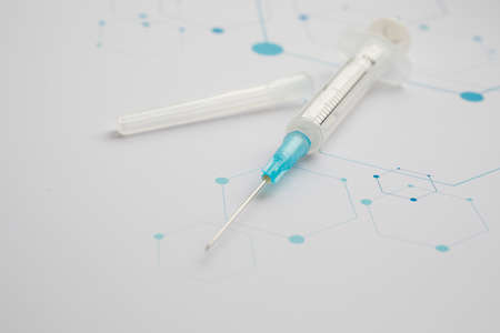 Medical syringe on the science backgroundの写真素材