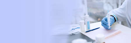 Doctor working in his office. Headline science and medical background.