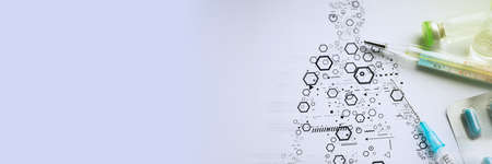 Medical ampoules and syringe on the science backgroundの写真素材