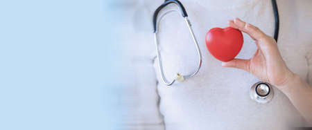 Doctor woman holding a heart in her hand