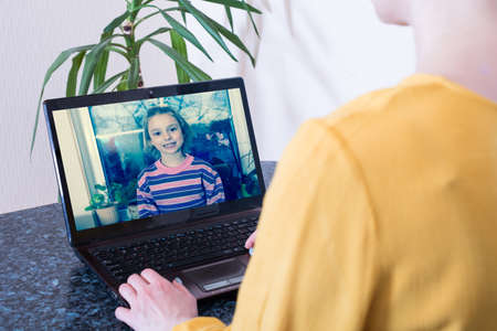 Chat over the internet during a pandemic.の写真素材