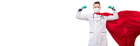 A doctor in a costume of a super hero stands on defense against a viral pandemicの写真素材