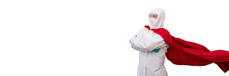 A doctor in a costume of a super hero stands on defense against a viral pandemicの写真素材