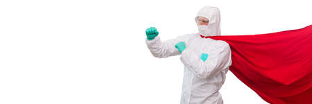 A doctor in a costume of a super hero stands on defense against a viral pandemicの写真素材