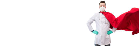 A doctor in a costume of a super hero stands on defense against a viral pandemicの写真素材