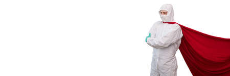 A doctor in a costume of a super hero stands on defense against a viral pandemicの写真素材