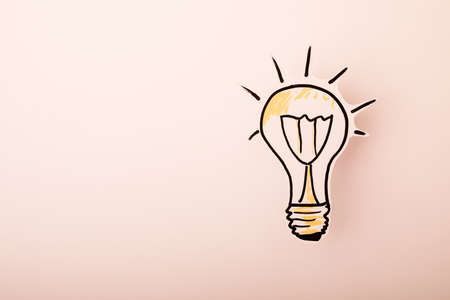 Paper drawn bulb on a white background. Creative concept.の写真素材
