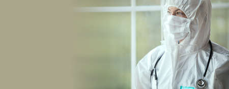 Female doctor wearing hygienic face surgical medical mask.