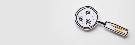 Magnifier and bacteria and virus cells on whiteの写真素材