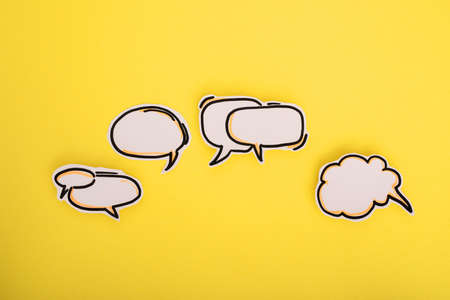 Paper speech bubbles icon on the yellowの写真素材