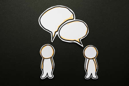 Abstract paper human figures with speech bubblesの写真素材