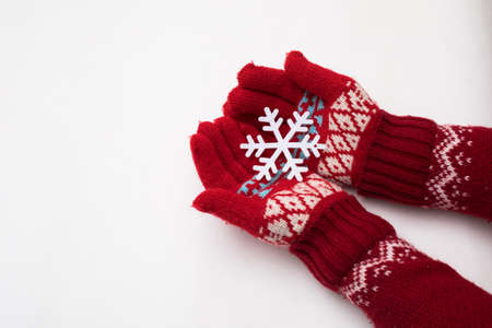Woman hand with chrismas toy isolated on whiteの写真素材