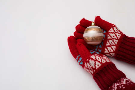 Woman hand with chrismas toy isolated on whiteの写真素材