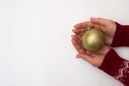 Woman hand with chrismas toy isolated on whiteの写真素材