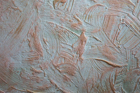 Stucco wall with gold paint