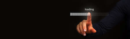 Finger pointing to loading to complete the yearの写真素材