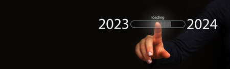 Finger pointing to loading to complete the yearの写真素材