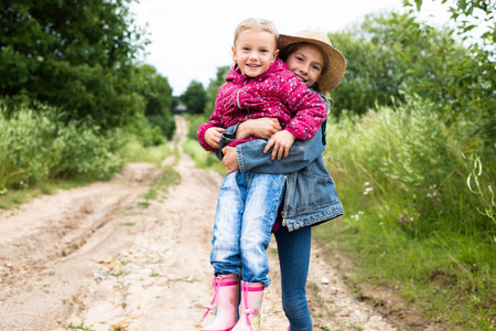 Smiling little girls child in dress outdoor in summer dayの写真素材