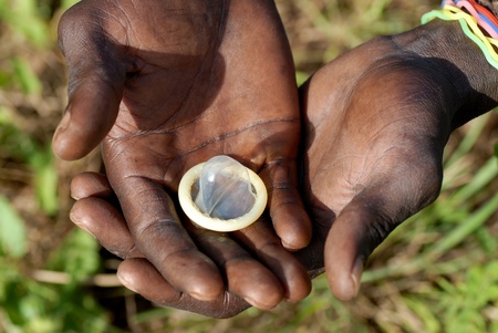 condom in the hands of an Africanの写真素材