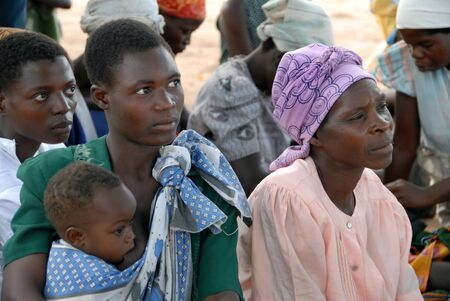Malawi-April,2007: woman breastfeeding her child. In Africa it is normal to see this gesture.のeditorial素材